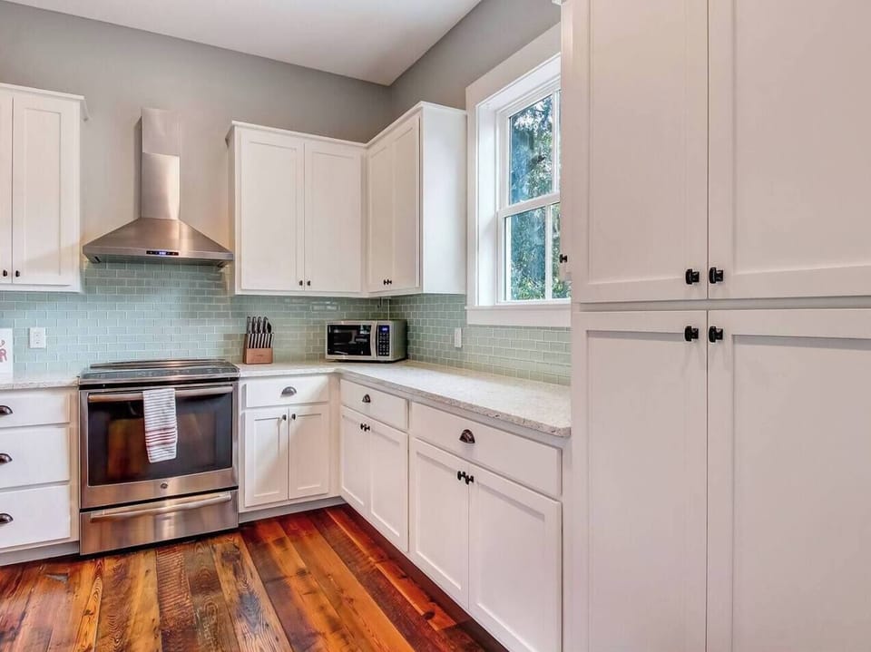 Oyster Cove kitchen, stainless electric range, microwave