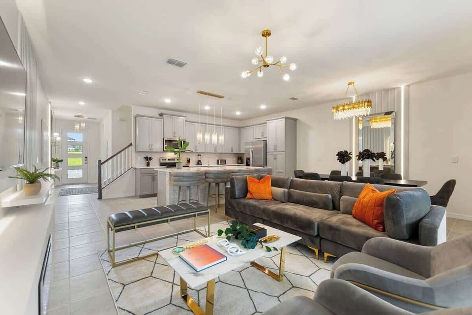 Cozy and spacious living room with comfortable seating and a smart TV for entertainment!