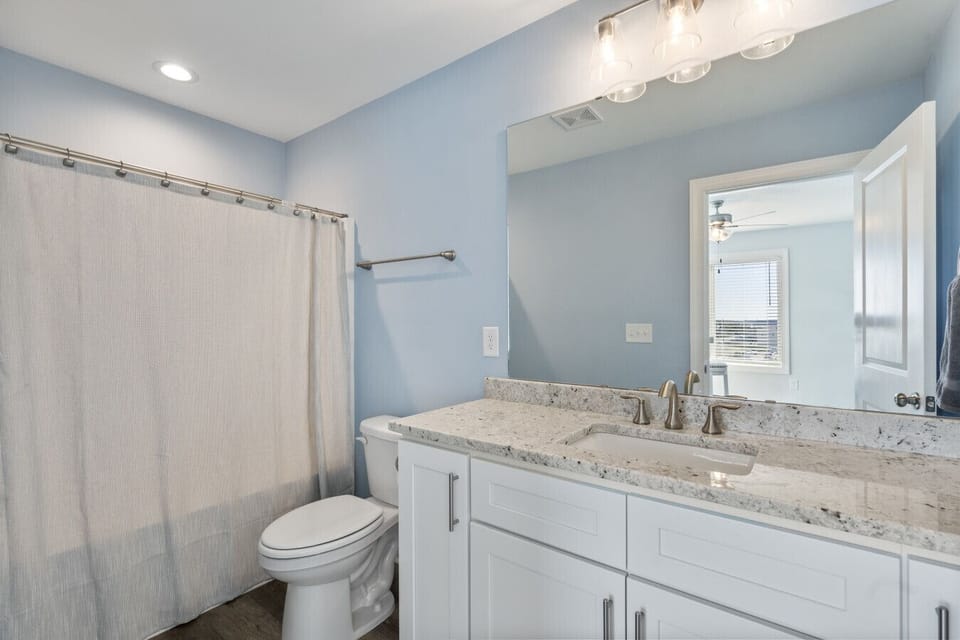 Guest bathroom with tub and shower
