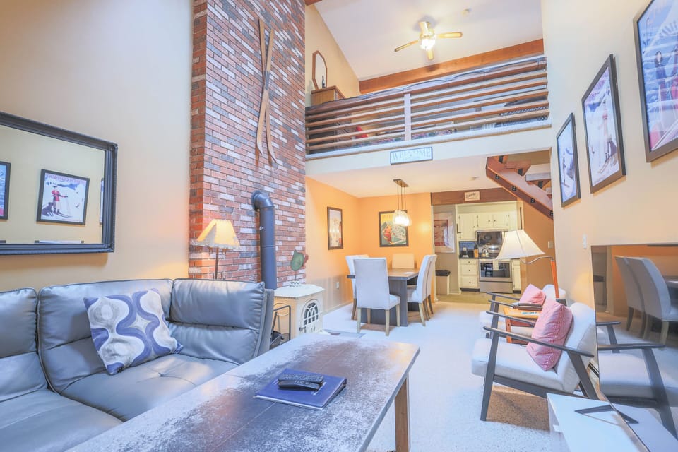 Living to kitchen area with view of childproof sleeping loft