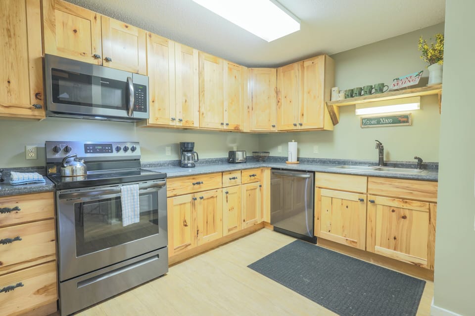 Full size appliances. Stocked with glassware, flatware, dishware, cookware and cooking utensils