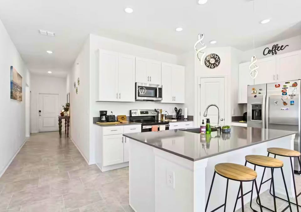 Fully equipped kitchen with stainless steel appliances.