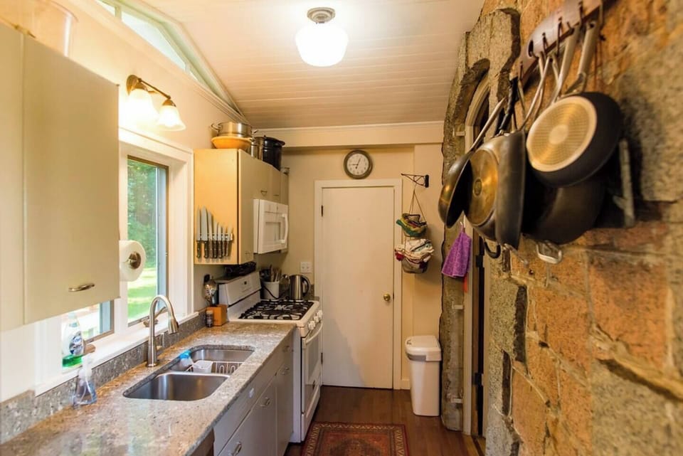 While cozy, the kitchen is well-equipped and ready for all your cooking needs. 