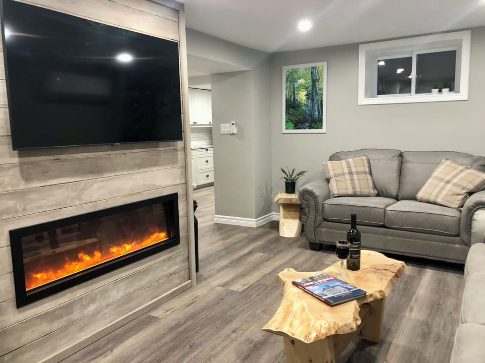 Enjoy relaxing in this living room with a cozy electric fireplace!