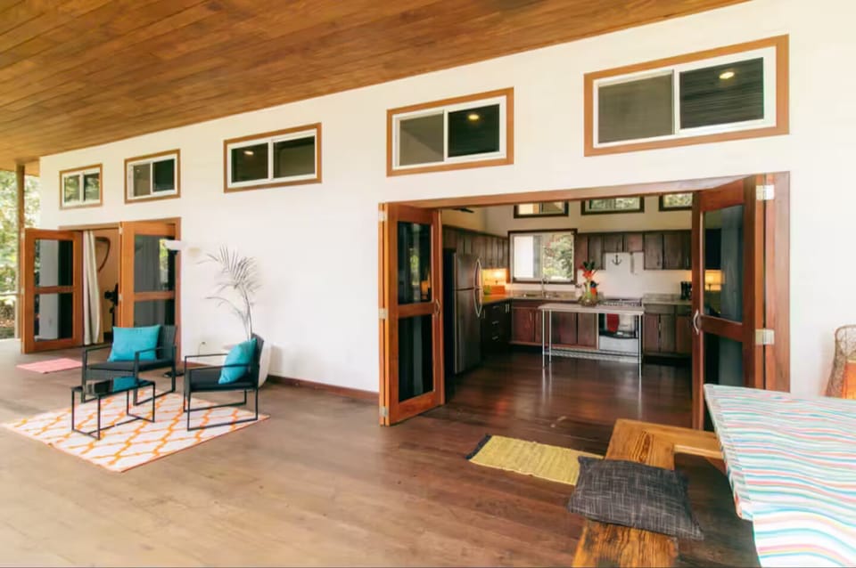View of kitchen and open doors to the master bedroom.