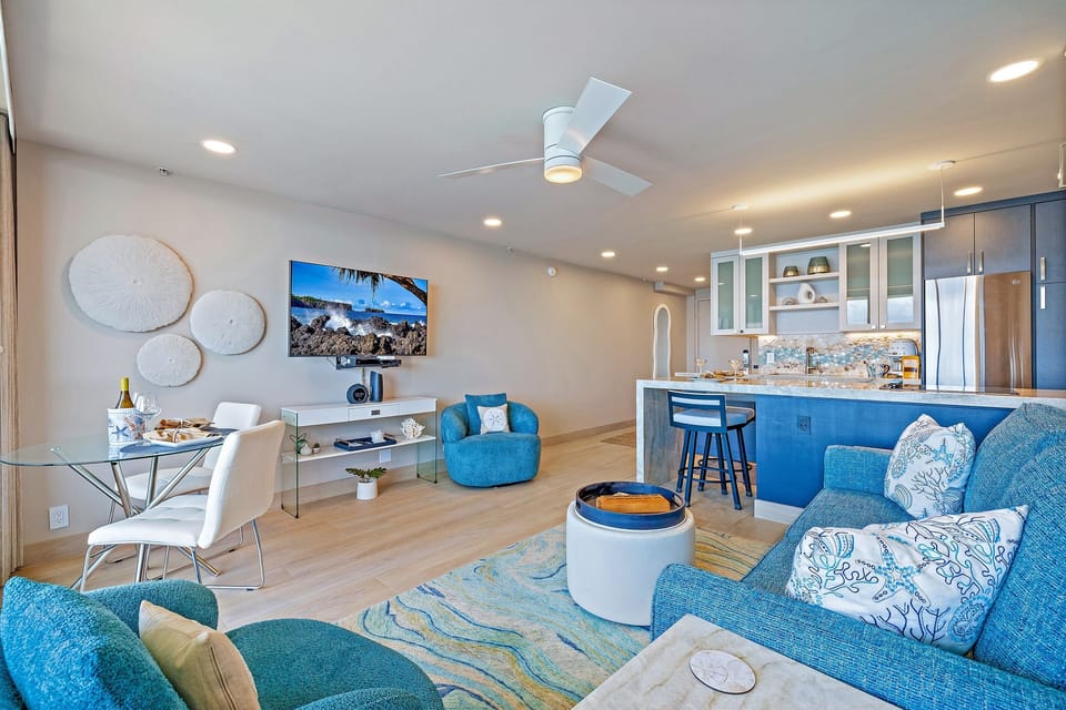 Living Room: Vibrant getaway with chic décor, ocean views, and dining for two!