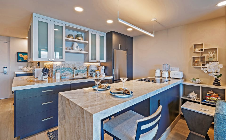 Kitchen: Sleek design meets island charm—enjoy delicious meals with stunning views.