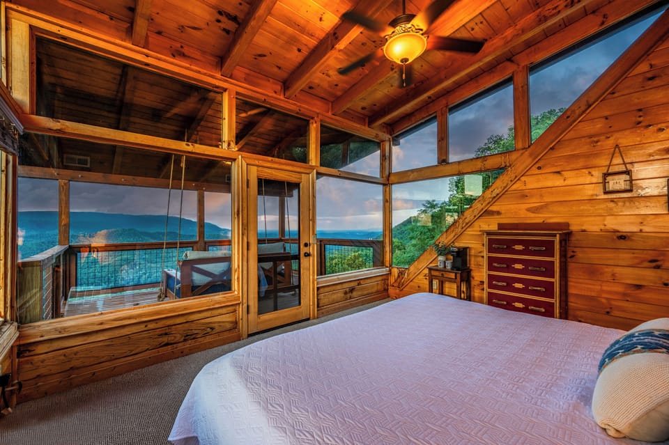 The 3rd-floor bedroom features a king bed, stunning views, a private balcony with a day bed, and an ensuite bathroom