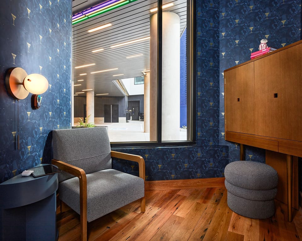 A cozy and stylish retreat for focused work or discussions, featuring warm lighting and contemporary decor for a comfortable atmosphere.