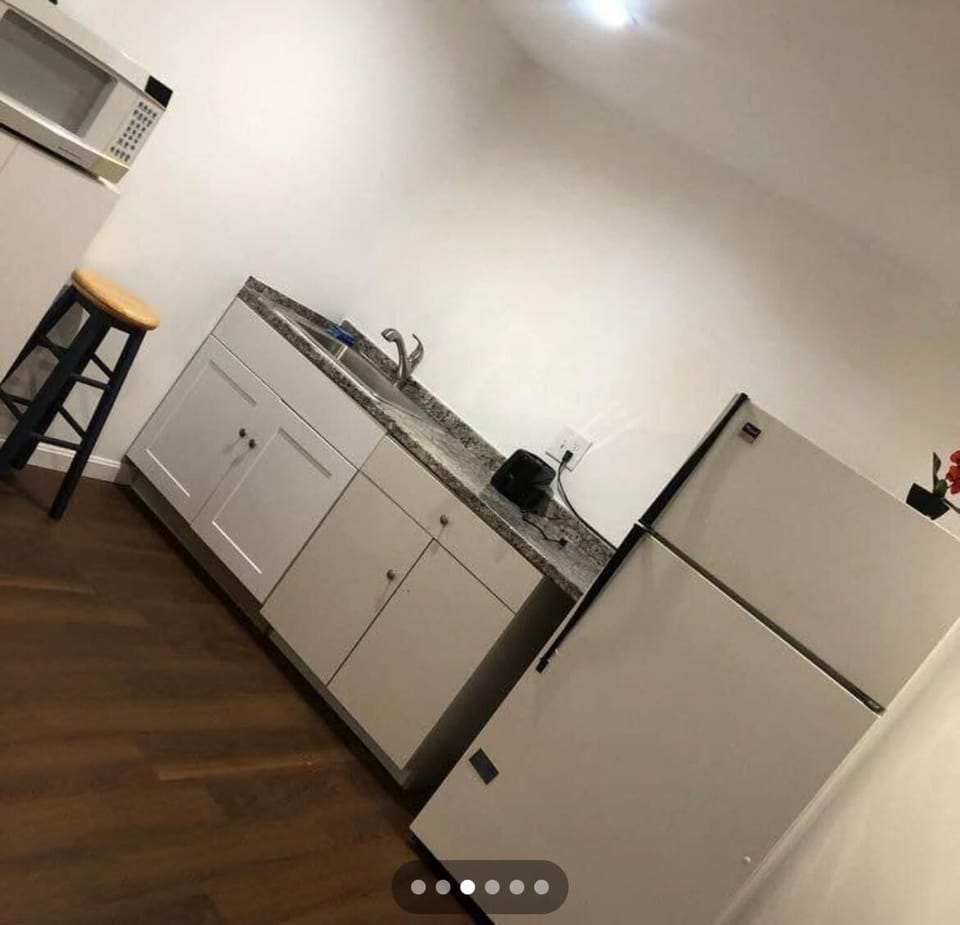 Basement kitchen and washer and dryer.