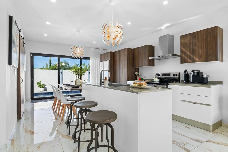 A designer, open-concept space where cooking, dining, and entertaining seamlessly blend. This kitchen is a showstopper and fully equipped for your group!