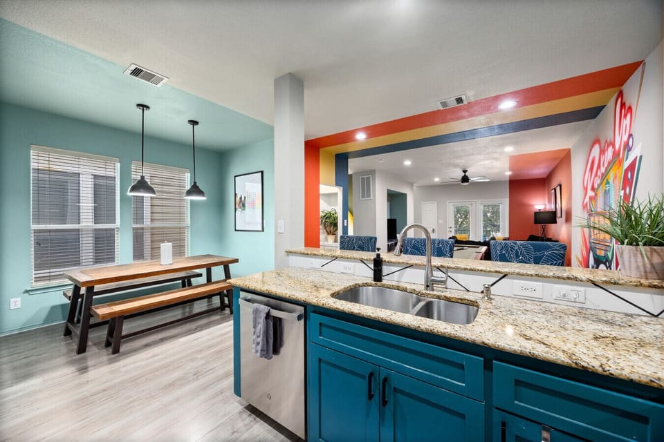 Open kitchen and dining area with natural light and seating for group meals—designed for connection and comfort.
