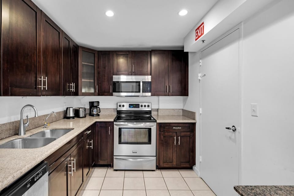 Beach Getaway: Modern 2BR Condo Pool & Gym Access (7602)