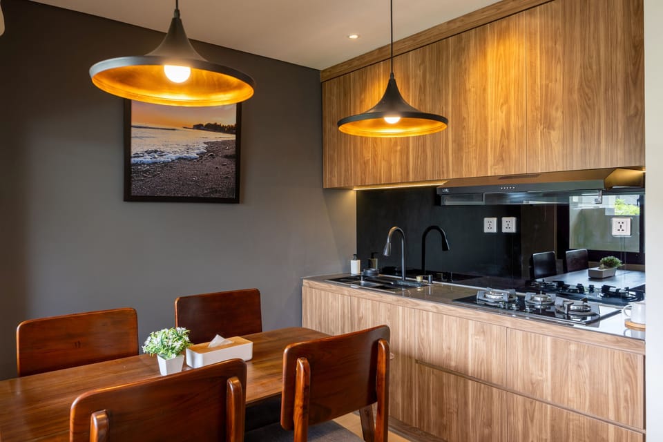 Suite, 1 Bedroom, Garden View | Private kitchen | Fridge, electric kettle, cookware/dishes/utensils, dining tables