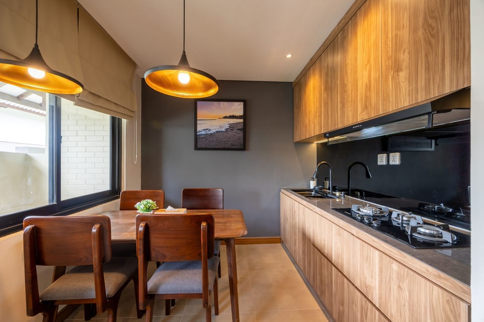 Suite, 1 Bedroom, Garden View | Private kitchen | Fridge, electric kettle, cookware/dishes/utensils, dining tables
