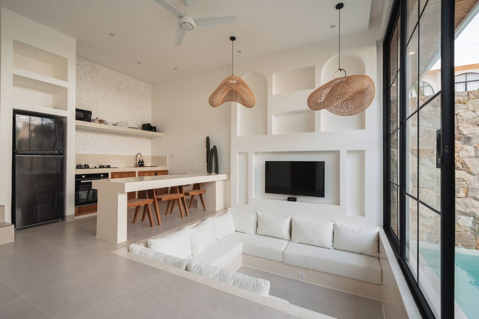 Deluxe Villa, 1 King Bed, Balcony, Pool View | Living area | 50-inch Smart TV with digital channels