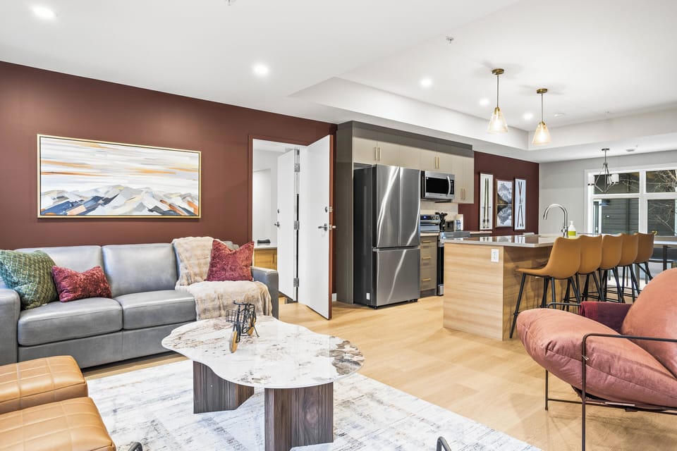 There is an adjoining door in the living room that leads to the adjacent 4-bedroom suite, making it perfect for accommodating large groups.
