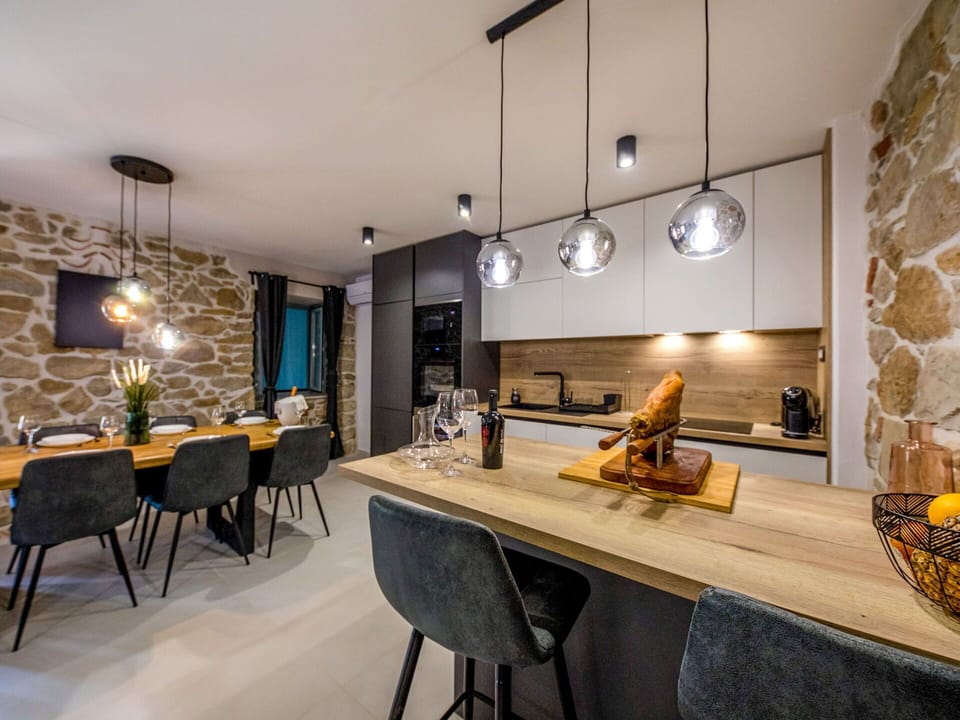 Furniture, Interior Design, Flooring, Countertop, Wood, Light Fixture, Ceiling, Kitchen, Floor, Lighting