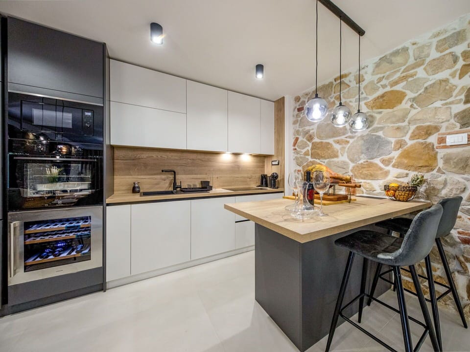 Furniture, Kitchen, Countertop, Interior Design, Flooring, Kitchen Appliance, Wall, Cabinetry, Wood, Ceiling