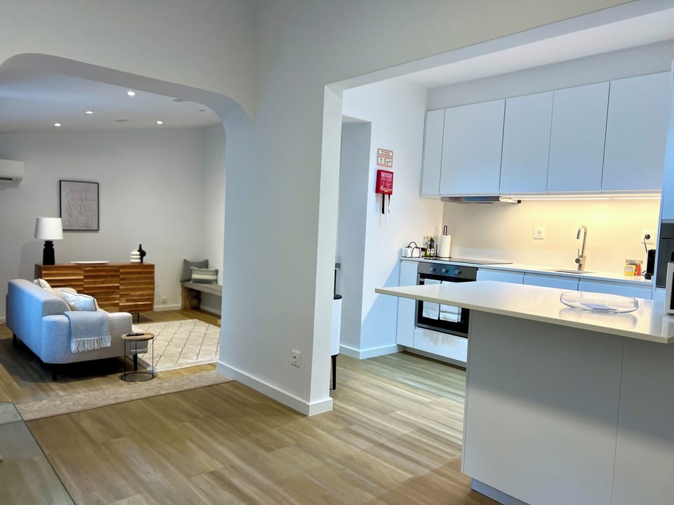 Open layout connecting kitchen, dining and living spaces