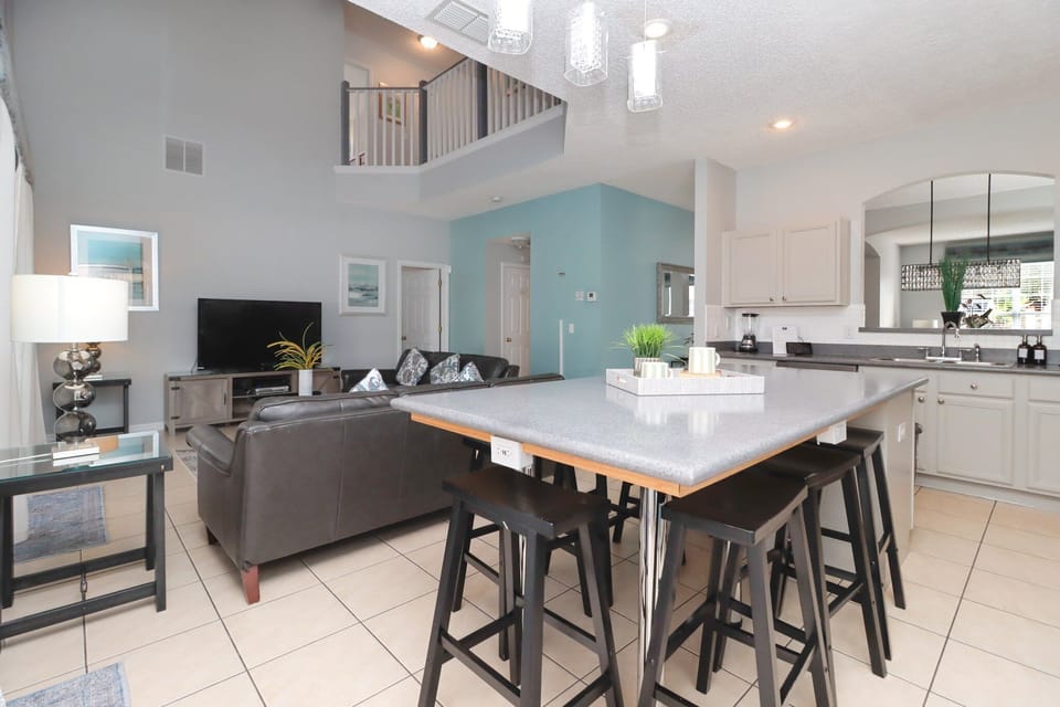 At the heart of the villa is a modern, fully equipped kitchen with all the appliances and gadgets you'll need. Prepare delicious family meals, enjoy quick breakfasts at the island bar, or serve snacks and drinks with ease throughout the day.
