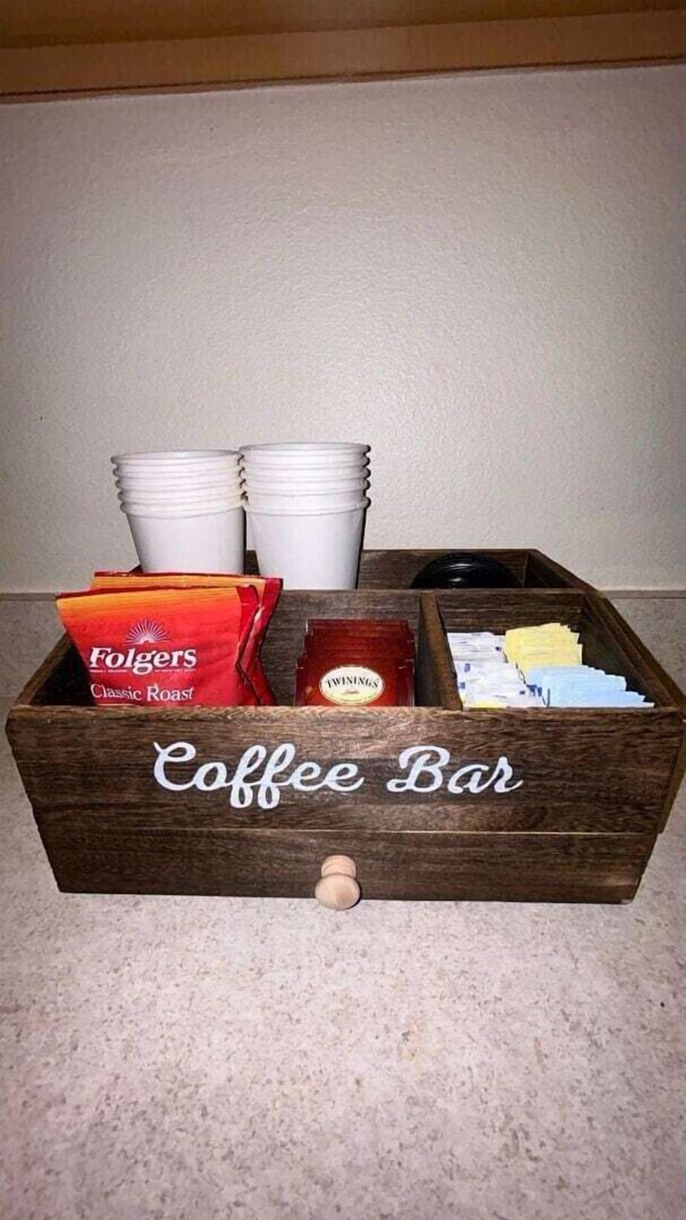 The complimentary coffee station goes beyond being just a functional feature—it creates a moment of hospitality and connection.