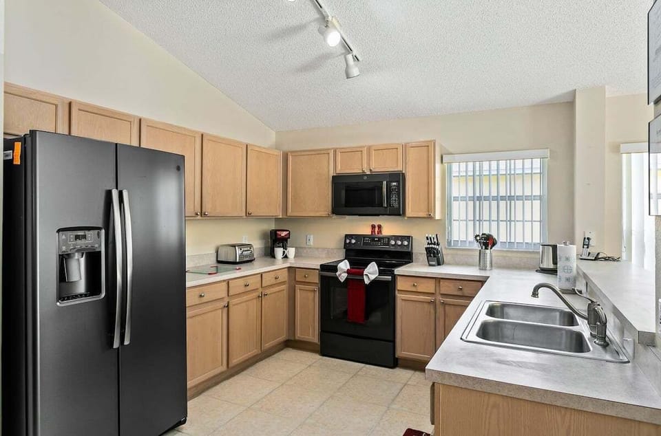 Modern appliances and ample counter space make meal preparation a breeze.