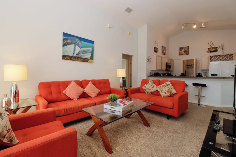 With a spacious, airy layout, it provides a perfect blend of comfort and style. The focal point of the room is a large flat-screen TV, offering a variety of entertainment options for those looking to relax and unwind.