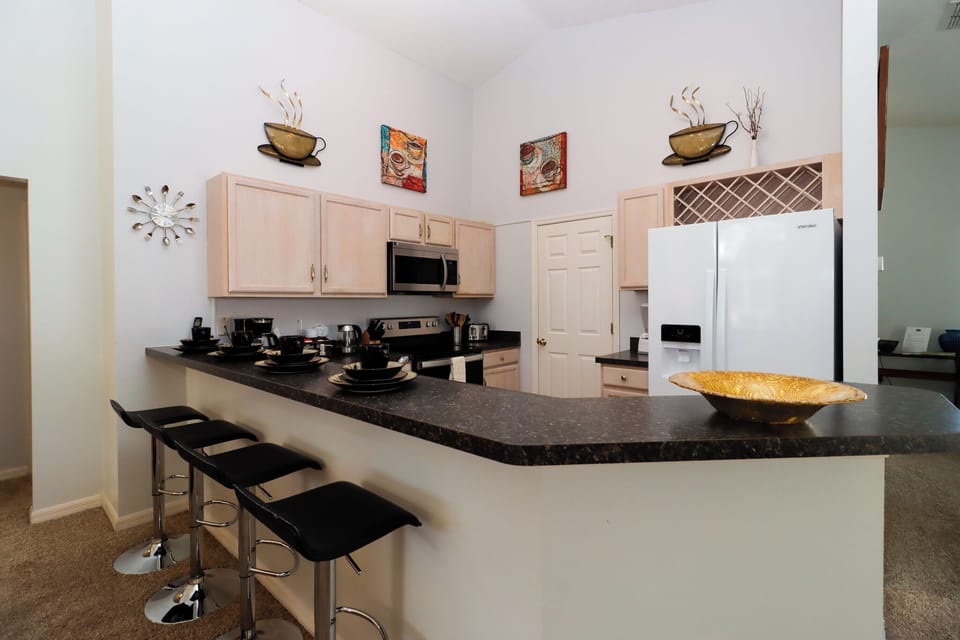 Located around the kitchen island or a sleek bar counter, this seating option is perfect for quick bites, morning coffee, or gathering with friends and family while meals are being prepared.