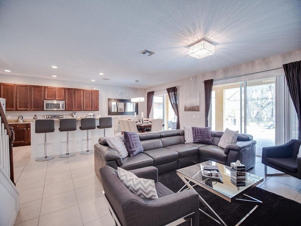 Comfortable living area with plenty of seating, open to the kitchen