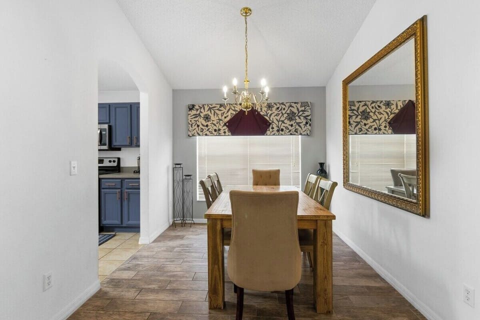 The large family dining area is a beautifully designed space that exudes a luxurious, resort-style ambiance, perfect for creating cherished memories over meals.