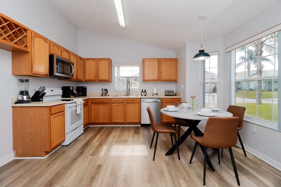 Designed for both function and style, the open kitchen features sleek countertops, state-of-the-art appliances, and ample space for preparing gourmet meals with ease.