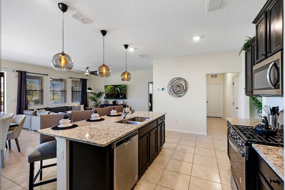 Perfect for both cooking enthusiasts and social gatherings, this elegant space combines sleek design elements with practical features