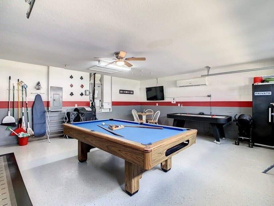 Located in Orlando near Disney, this bright and colourful game room includes a pool table, TV, board games, and ample space for the whole family to unwind together.