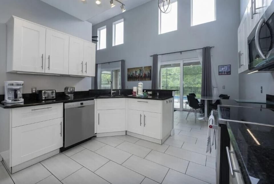 An updated kitchen with modern appliances, open to the family room, is the perfect blend of functionality, style, and convenience.