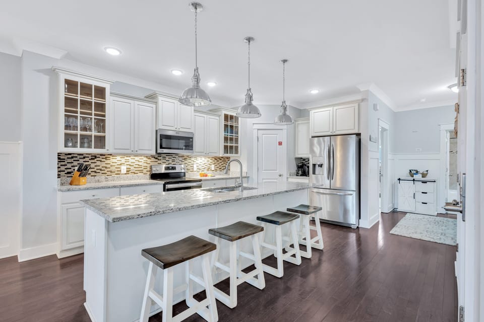 Start your day with a quick meal at the kitchen island, or come together for a delicious feast at the indoor dining table or outdoor dining area.