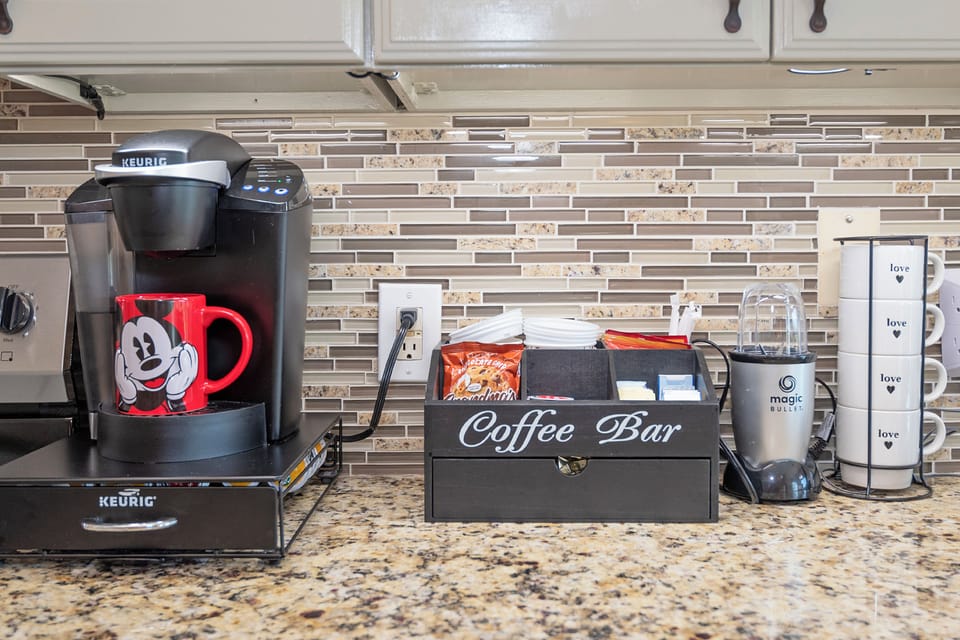 Spacious kitchen with stainless steel appliances, granite countertops, and all the cookware and utensils you need for family meals.