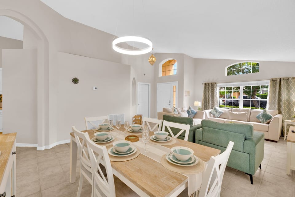 Open layout joins lounge and dining in this Florida vacation villa just minutes from Disney parks.