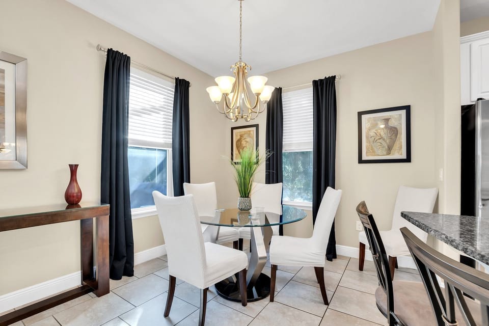 Enjoy a bright and inviting breakfast nook, perfect for sipping coffee and planning your next Florida adventure! Whether you're fueling up for a Disney day or relaxing with a peaceful morning meal, this charming space is just right.