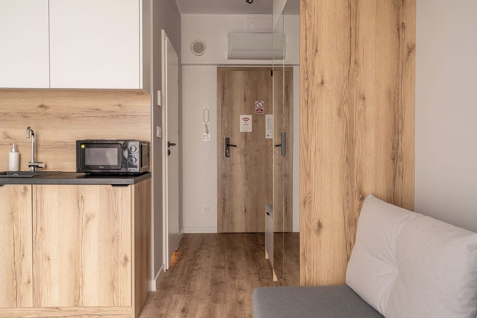 Studio Suite, Balcony | Living area | TV