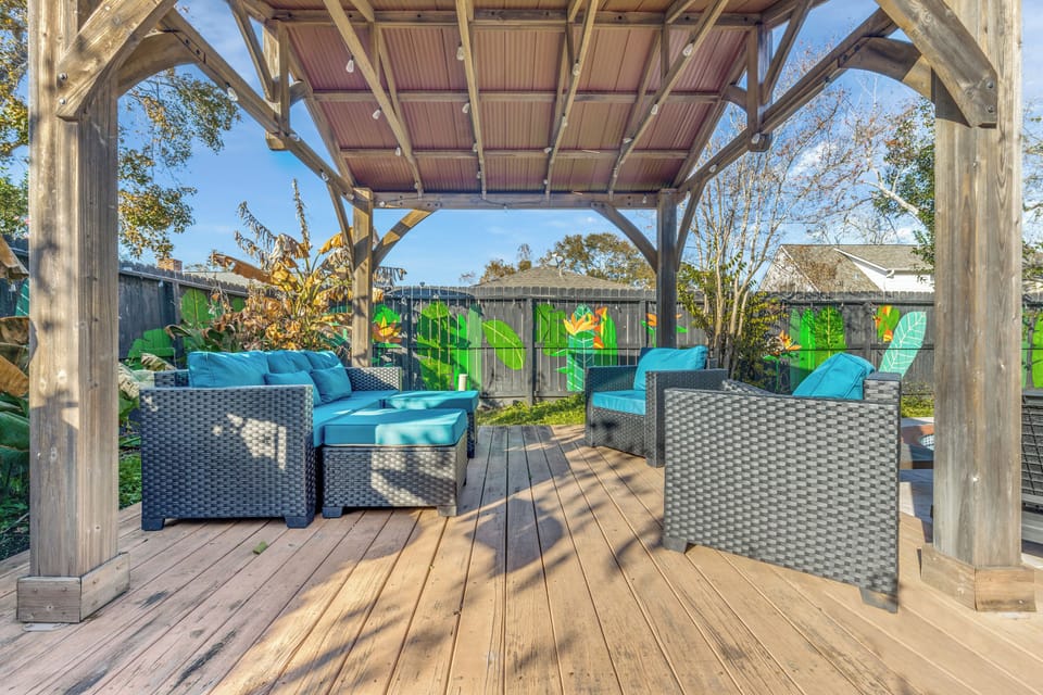 Relax under the pergola with a propane grill, lounge chairs, and pool.
