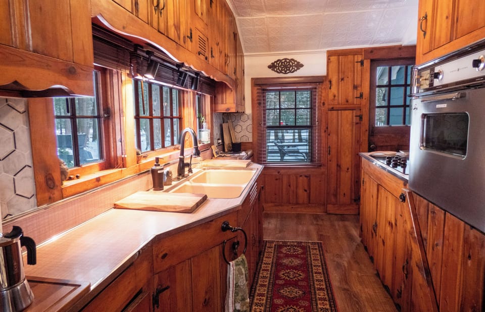 Kitchen with windows on all sides.