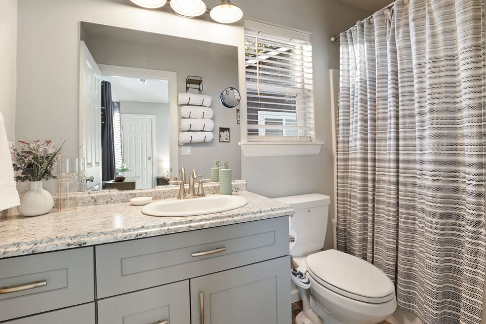 Bathroom #1 of 3: primary bedroom en suite with tub/shower combo