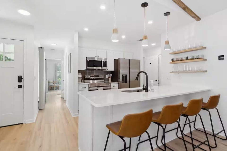 Open concept kitchen and living room to host your group in.