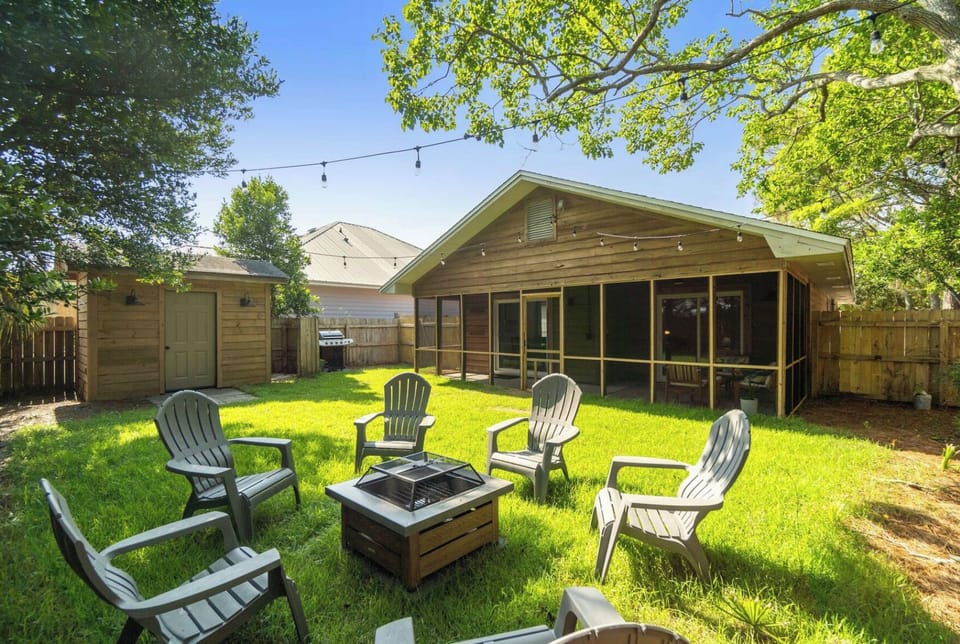 Backyard Garden. Enjoy the cozy backyard with string lights, a fire pit and a BBQ grill setup. Space to enjoy for kids, animals and adults. Fully enclosed and safe for littles to hang out in!