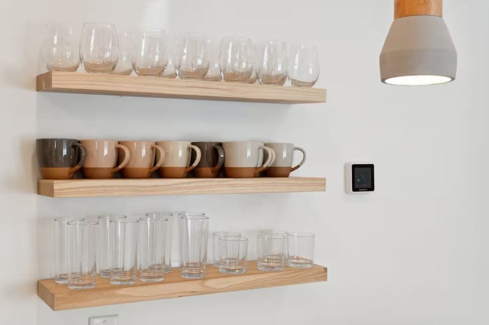 Floating shelves with ample drink ware for both the cooler and warmer days in Florida!