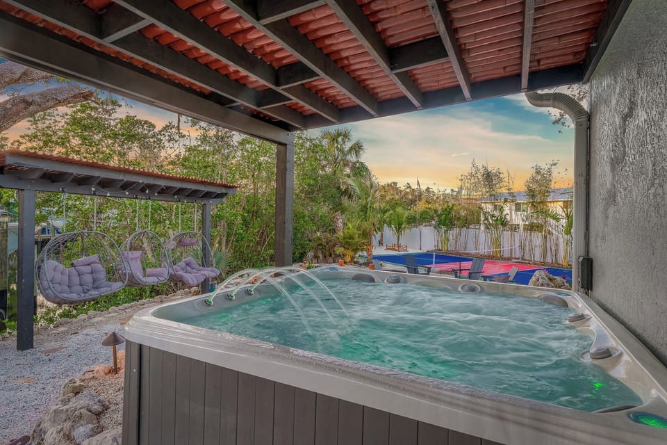 Indulge in the luxurious experience of our private hot tub, nestled beneath a shaded pergola. It's the ideal setting for ultimate relaxation and serenity.