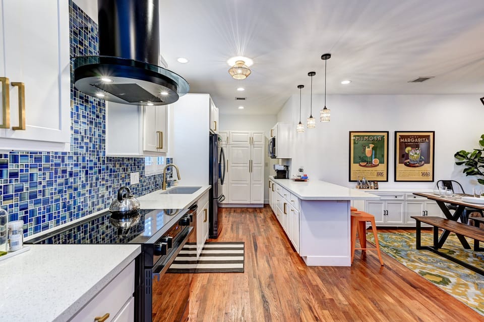 Fully equipped kitchen with ample counter space and modern appliances