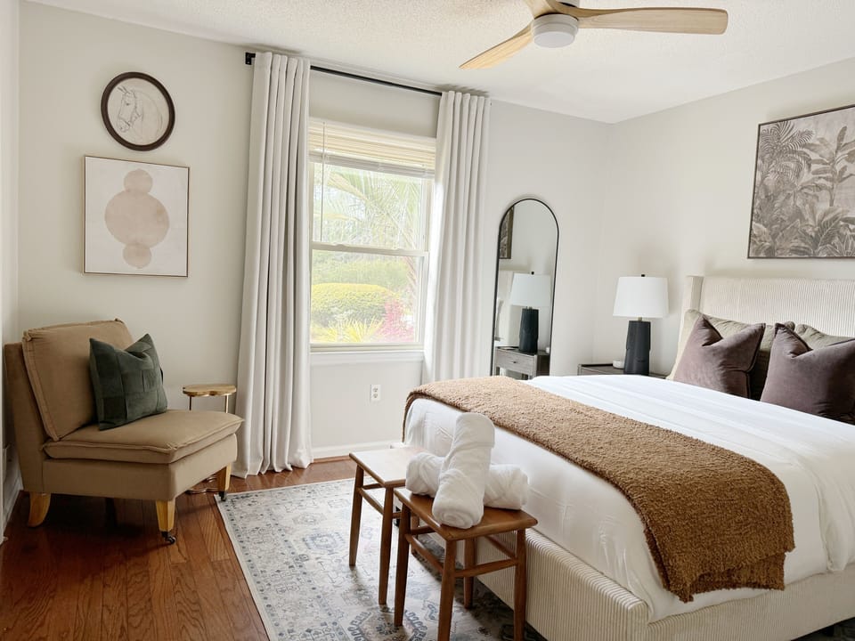Sunny bedroom filled with natural light and soft, airy décor.