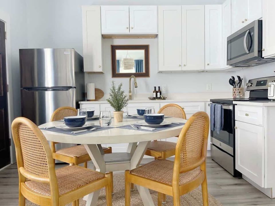 Enjoy a small dining area ideal for meals while staying connected to the living and kitchen spaces with this area.